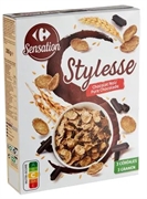 CARREFOUR SENSATION PÉTALES DE RIZ, BLÉ COMPLET ET ORGE COMPLÈTE ENROBÉS DE SUCRE AVEC DES COPEAUX DE CHOCOLAT NOIR.